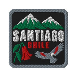 May include: A square embroidered patch with a black background and a gray border. It features green and white mountains, the white text SANTIAGO, the red text CHILE, a red copihue flower with green leaves, and a gray and red Andean condor bird.