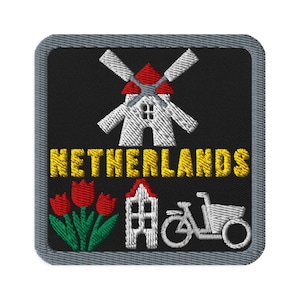May include: A square embroidered patch with a black background and a gray border. It features a white windmill with a red roof, the yellow text NETHERLANDS, three red tulips with green stems, a white canal house, and a white bicycle graphic.