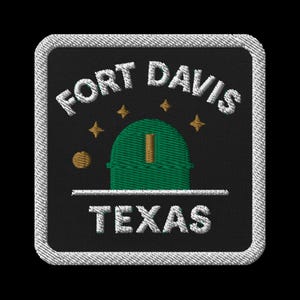 May include: Embroidered patch featuring "FORT DAVIS TEXAS" in white text. The design includes a green observatory, gold stars, and a gold circle on a black background, framed by a white stitched border.
