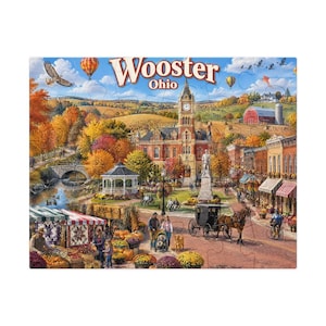 May include: A jigsaw puzzle depicting a fall scene in Wooster, Ohio, featuring a town square with a clock tower, a gazebo, a horse-drawn carriage, and market stalls. The landscape includes autumn trees, a river, and hot air balloons in the sky.