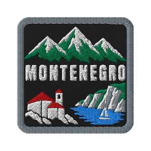 May include: A square embroidered patch with a grey border on a black background. It features white and green mountains, a white building with a red roof, a blue sea, and a white sailboat. The text MONTENEGRO is embroidered in white letters.