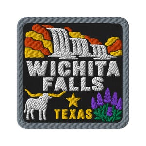 May include: A square embroidered patch with a black background and a gray border. It features a white waterfall, orange and yellow rock formations, a white longhorn steer, a yellow star, purple flowers, and the text WICHITA FALLS TEXAS.