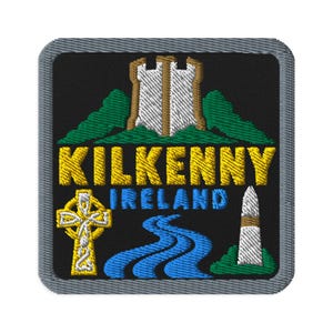 May include: A square embroidered patch with a gray border on a black background. It features a white castle, green hills, a yellow Celtic cross, a blue river, and a white obelisk. The text reads KILKENNY in yellow and IRELAND in blue.