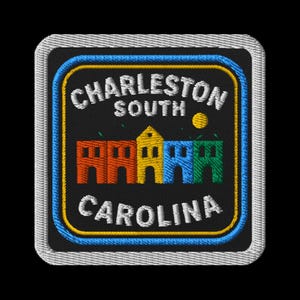 May include: Embroidered patch featuring the text "Charleston South Carolina" in white, with a colorful illustration of buildings. The patch has a black background with a yellow and blue border, and a white stitched edge.