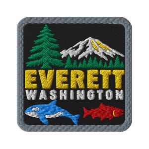 May include: A square embroidered patch with a black background and a gray border. It features a green pine tree, a white and yellow mountain, and the text EVERETT WASHINGTON in yellow and white. Below, a blue orca and a red salmon are depicted.