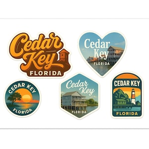 May include: A collection of five colorful stickers featuring the words "Cedar Key Florida." The stickers have various shapes, including a heart, circle, and hexagon, each with a unique design showcasing the Florida location.