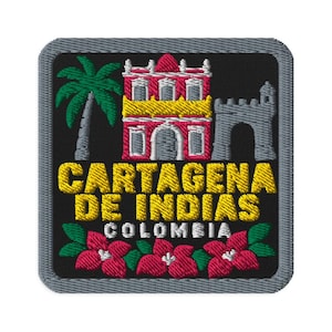 May include: A square embroidered patch with a black background and a grey border. It features a green palm tree, a red and yellow building, a grey stone archway, and pink flowers. The text reads CARTAGENA DE INDIAS COLOMBIA in yellow and white.
