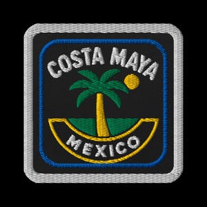 May include: Embroidered patch featuring the words "COSTA MAYA MEXICO" in white and yellow. The design includes a palm tree, sun, and ocean waves in green and yellow against a black background, framed by a blue border and a white stitched edge.