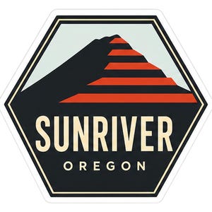 May include: A hexagonal sticker featuring a stylized mountain graphic with alternating black and orange horizontal stripes against a light blue sky. The text SUNRIVER is printed in large cream letters above the word OREGON in smaller cream letters.