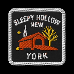May include: Embroidered patch featuring a red covered bridge, a yellow tree, and a church steeple against a black background. The text "Sleepy Hollow New York" is arched above the image in white.