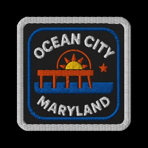 May include: Embroidered patch featuring "Ocean City Maryland" in white text on a black background. The design includes a pier with a sun and star, outlined in blue and orange. The patch has a white border.