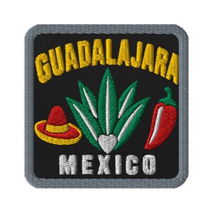 May include: A square embroidered patch with a black background and a grey border. It features the yellow text GUADALAJARA at the top and white text MEXICO at the bottom. Centered is a green agave plant, a red sombrero, and a red chilli pepper.