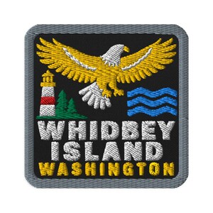 May include: A square embroidered patch with a grey border on a black background. It features a yellow eagle, a red and white lighthouse, green pine trees, and blue waves. The text reads WHIDBEY ISLAND WASHINGTON in white and yellow thread.