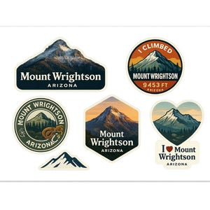 May include: A collection of Mount Wrightson stickers in various shapes, including a rectangle, circle, hexagon, and heart. The stickers feature mountain illustrations with text such as "I Climbed Mount Wrightson" and "Arizona."