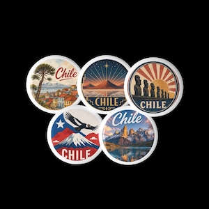 May include: Five circular pin-back buttons featuring colourful illustrations of Chile. Designs include a coastal town with an araucaria tree, a mountain landscape with a star, Moai statues at sunset, an Andean condor, and the Torres del Paine peaks.