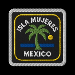 May include: Embroidered patch with the text "ISLA MUJERES MEXICO", a palm tree, and a yellow sun. The patch has a black background, a yellow border, and a white stitched edge.