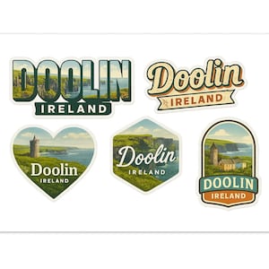 May include: A collection of five stickers featuring the word "Doolin" and "Ireland" in various designs. The stickers showcase scenic views of cliffs, a castle, and the ocean, with a vintage travel aesthetic. The color palette includes greens, blues, and browns.