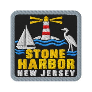 May include: A square embroidered patch with a black background featuring a red and white lighthouse, a white sailboat, and a white heron above blue waves. The text reads STONE HARBOR in yellow and NEW JERSEY in white with a grey border.
