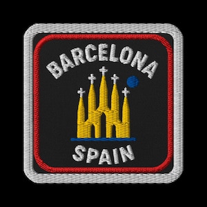 Może przedstawiać: Haftowana naszywka z napisem "BARCELONA" nad żółto-niebieskim projektem architektonicznym i "SPAIN" poniżej. Naszywka ma czarne tło z czerwoną i białą obwódką.