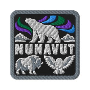 May include: A square embroidered patch with a black background and a gray border. It features a white polar bear, a muskox, and an owl, with green, blue, and purple aurora borealis patterns above. The word NUNAVUT is embroidered in white letters.