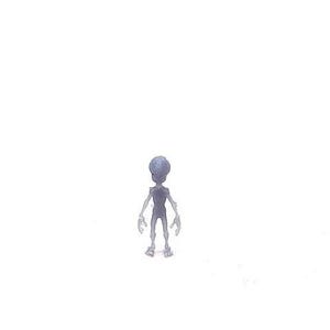 May include: A small, gray alien figurine with a large head and slender limbs stands against a white background. The figurine has a smooth texture and a slightly translucent appearance, suggesting it may be made of resin or a similar material.