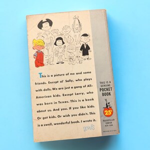 May include: A vintage paperback book cover featuring a cartoon illustration of a group of children, including Dennis the Menace. The text on the cover reads "This is a picture of me and some friends. Except ol' Sally, who plays with dolls. We are just a gang of All-American kids. Except Larry, who was born in Texas. This is a book about us. And you. If you like kids. Or got kids. Or wish you didn't. This is a swell, wonderful book. I wrote it. DENNIS." The back cover features a "This is a Genuine Pocket Book" logo with a price of 25 cents.