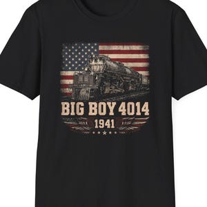 May include: Black t-shirt featuring a vintage train graphic with the American flag in the background. The design includes the text "BIG BOY 4014" and "1941" in a distressed font, with wing and star accents.