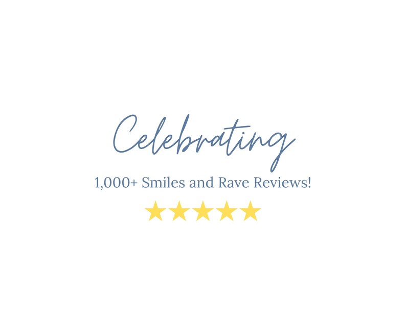 May include: White background with the text "Celebrating 1,000+ Smiles and Rave Reviews!" in blue script. Below the text are five yellow stars, representing a five-star rating.