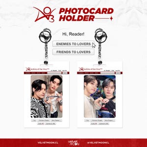 May include: Photocard holder with two photo card inserts, each featuring a different image of two people. The holder has a silver keychain and the text "Hi, Reader!" and "ENEMIES TO LOVERS" and "FRIENDS TO LOVERS". The bottom of the holder has the text "VELVETMOON.CL".