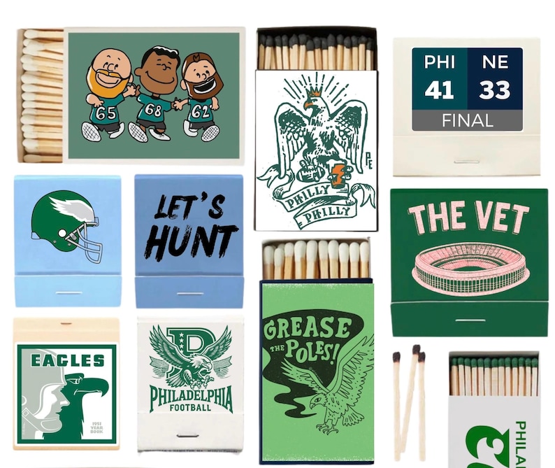 May include: A collection of matchboxes with various Philadelphia Eagles-themed designs. The boxes feature illustrations of the team's logo, players, and stadium, along with phrases like "Let's Hunt" and "Grease the Poles!" The color scheme includes green, blue, and white.