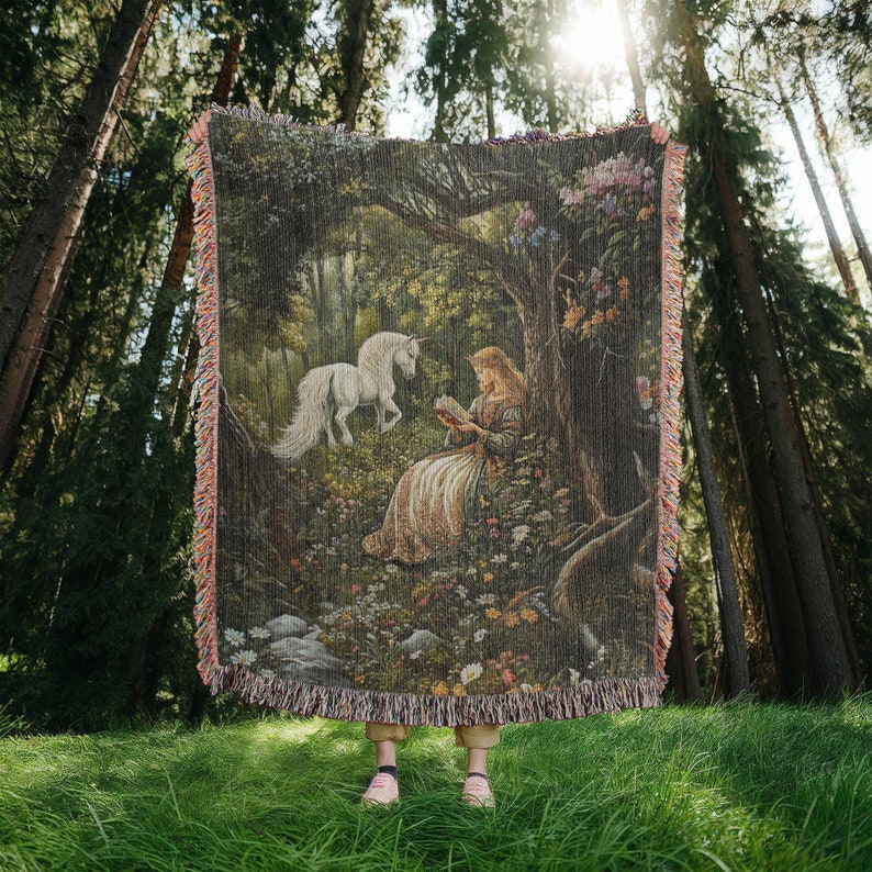 100 percent cotton woven fringe wall tapestry or blanket featuring a medieval princess reading a book in an enchanted forest while a unicorn watches over her