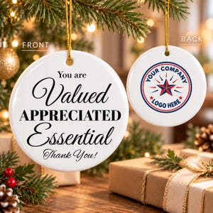 May include: Two round white ceramic ornaments with gold hanging strings. The front ornament features black text reading "You are Valued APPRECIATED Essential Thank You!". The back ornament displays a circular logo with a red and blue star.