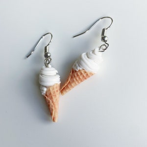 Softs-serve ice cream dangle earrings on a white background.