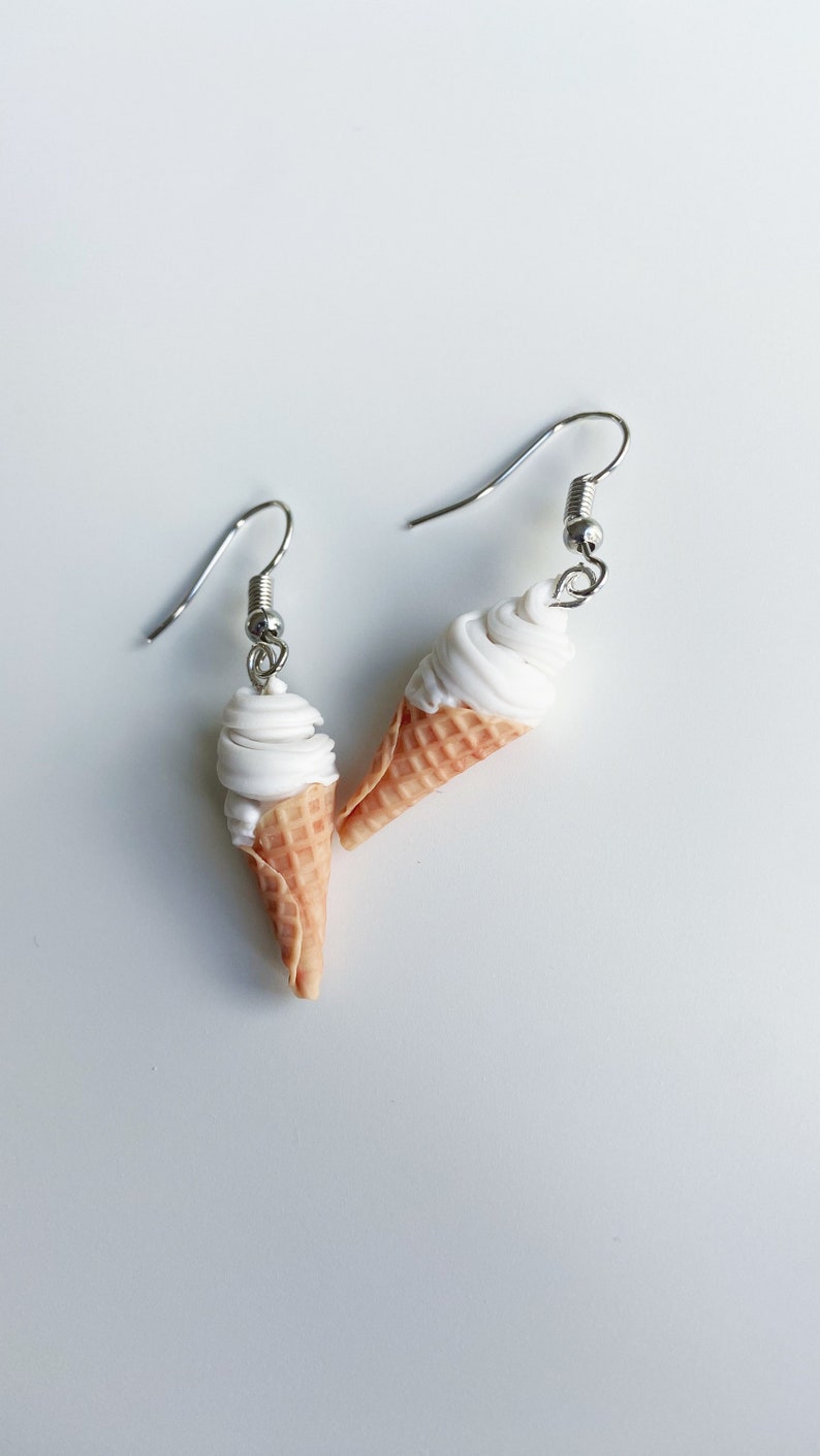 Softs-serve ice cream dangle earrings on a white background.