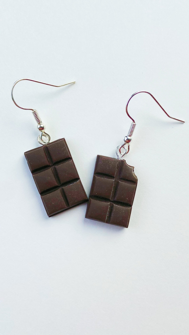 Dark chocolate bar dangle earrings. Right chocolate bar is missing a tiny bite of the chocolate in the top corner.