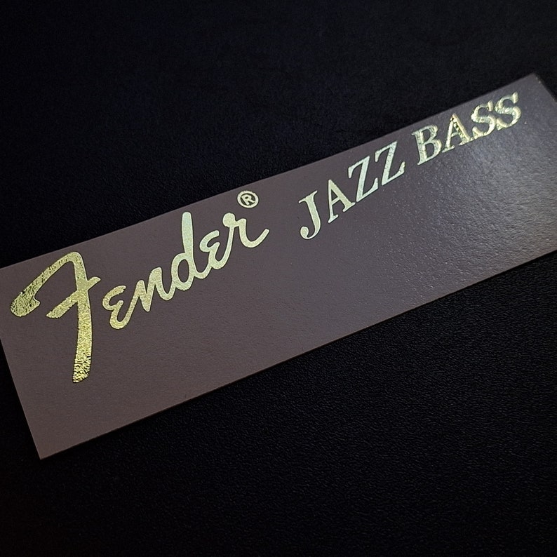 Upgrade your Fender Jazz Bass with our high quality durable waterslide headstock decal. You will be the envy of your whole band with this sticker on your bass. Show off to the audience with your authentic, EPIC WIN Jazz Bass Fender waterslide decal.