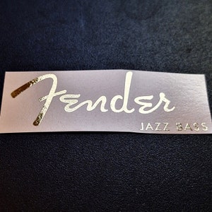 Upgrade your Fender Jazz Bass with our high quality durable waterslide headstock decal. You will be the envy of your whole band with this sticker on your bass. Show off to the audience with your authentic, EPIC WIN Jazz Bass Fender waterslide decal.