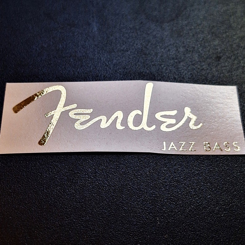 Upgrade your Fender Jazz Bass with our high quality durable waterslide headstock decal. You will be the envy of your whole band with this sticker on your bass. Show off to the audience with your authentic, EPIC WIN Jazz Bass Fender waterslide decal.