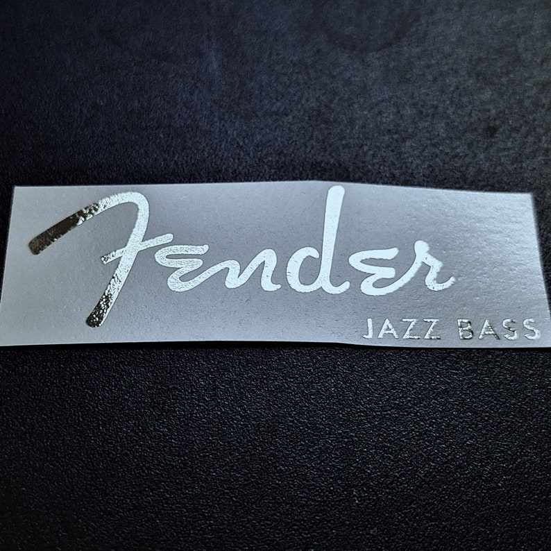 Upgrade your Fender Jazz Bass with our high quality durable waterslide headstock decal. You will be the envy of your whole band with this sticker on your bass. Show off to the audience with your authentic, EPIC WIN Jazz Bass Fender waterslide decal.