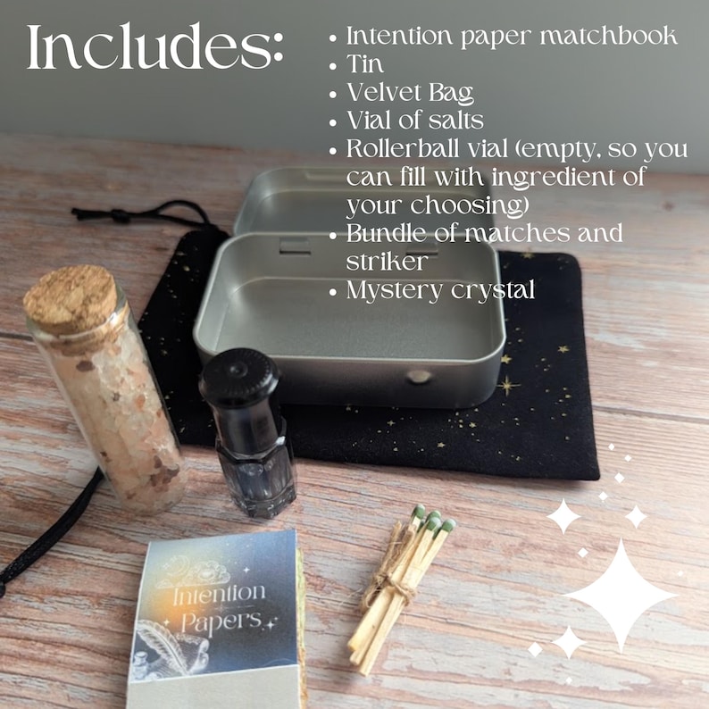 May include: An assortment of spiritual items including a tin, velvet bag, vial of salts, rollerball vial, matches, and a mystery crystal. The image also includes a matchbook labeled "Intention Papers."