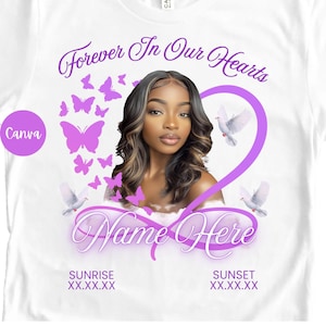May include: White t-shirt featuring a portrait of a person with long, wavy hair, surrounded by purple butterflies and doves. The text "Forever In Our Hearts" and "Name Here" are displayed in elegant script. The shirt also includes the text "Sunrise" and "Sunset" with dates.