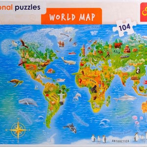 May include: A Trefl brand educational puzzle box featuring a colourful world map illustration. The map displays continents, oceans, and various animals, landmarks, and vehicles. The box includes the text Educational puzzles, WORLD MAP, 104, and 5+.