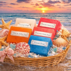 May include: A woven basket filled with colorful soaps, seashells, and starfish on a sandy beach. The soaps are labeled "Coconut Soap", "Bain de Solei Soap", "Hawaiian Sunset Soap", and "Ocean Soap". A pink bow adds a decorative touch.