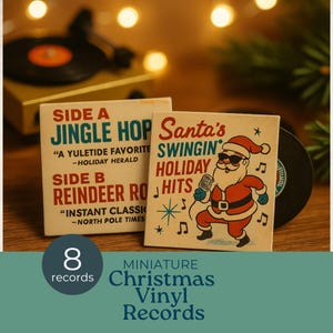 May include: Miniature Christmas vinyl records with festive designs. One record cover features Santa Claus singing into a microphone. The other cover reads "Jingle Hop" and "Reindeer Rock." The set includes 8 records.