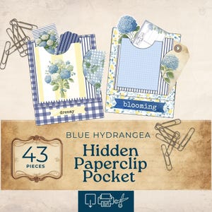May include: Two decorative paperclip pockets with blue hydrangea designs. One pocket has a gingham pattern, the other has stripes. The pockets contain floral cards and tags. The text "dreamy" and "blooming" are visible. The image also includes paperclips and the text "43 pieces".