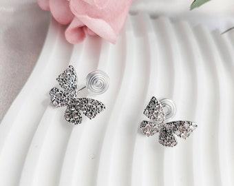 Boucles d'oreilles à clip pour femme | Puces d'oreilles papillon argentées brillantes | Nouveau design de bobine à clip sans douleur | Oreilles non percées, cadeaux pour elle