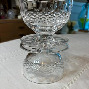 May include: A set of three clear glass bowls with a diamond pattern. The bowls are stacked on top of each other.