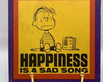 Peanuts Buch - Happiness is a Sad Song, 1st edition