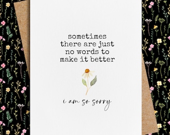 May include: A white card with black text that reads "sometimes there are just no words to make it better i am so sorry". A small watercolor illustration of a white daisy with a yellow center is above the text.