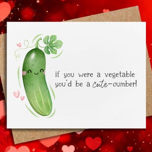 May include: A greeting card with a watercolor illustration of a smiling cucumber with a leaf and tendrils. The text reads, "if you were a vegetable you'd be a cute-cumber!" Pink hearts are in the corner.
